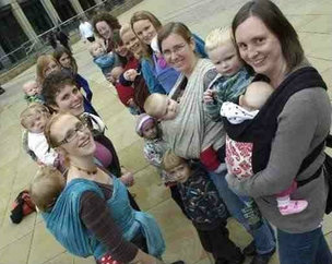 Several babywearers photographed with their babies outside Sheffield City Hall
